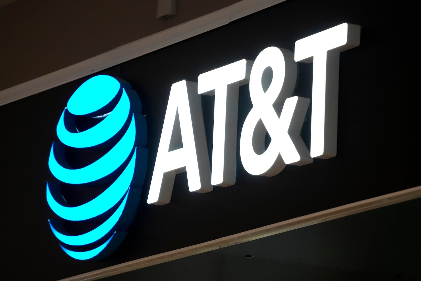 FILE - An AT&T sign is seen at a store in Pittsburgh, Monday, Jan. 30, 2023. (AP Photo/Gene J. Puskar, File, File)