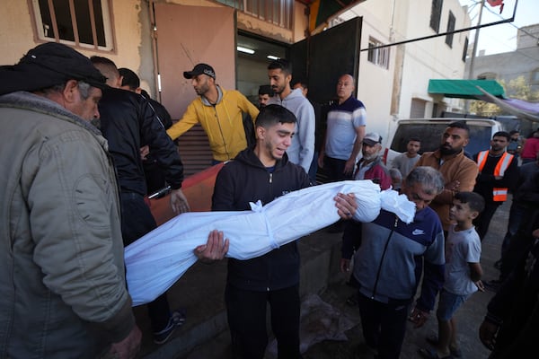 Palestinians mourn nine people killed in an Israeli strike in Bureij refugee camp, Gaza Strip, Friday, Nov. 15, 2024. (AP Photo/Abdel Kareem Hana)