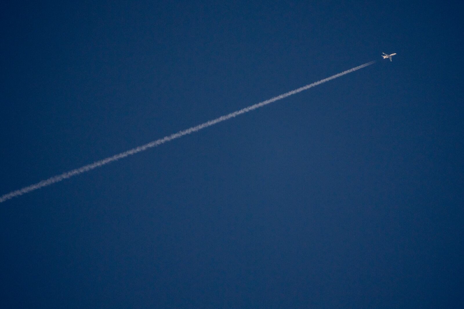 An Israeli surveillance aircraft seen from Hadera flies over the Mediterranean sea towards northern Israel, on Tuesday, Sept. 24, 2024. (AP Photo/Ariel Schalit)