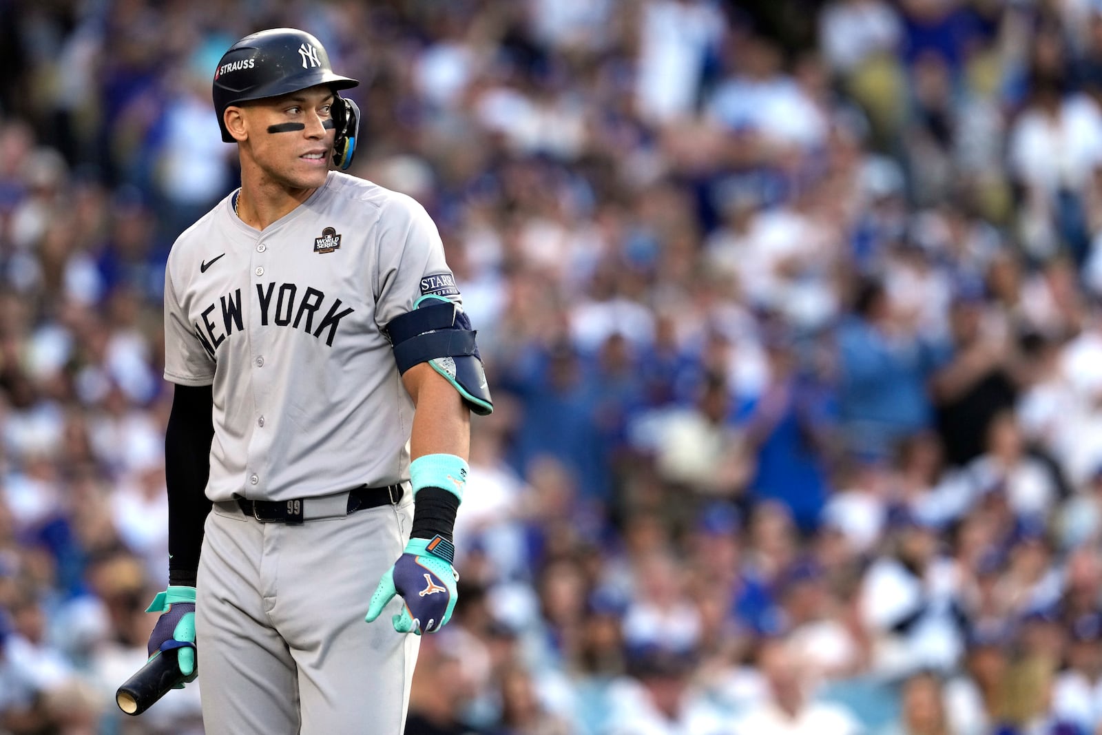 New York Yankees' Aaron Judge walks back to the dugout after striking out against the Los Angeles Dodgers during the first inning in Game 2 of the baseball World Series, Saturday, Oct. 26, 2024, in Los Angeles. (AP Photo/Godofredo A. Vásquez)