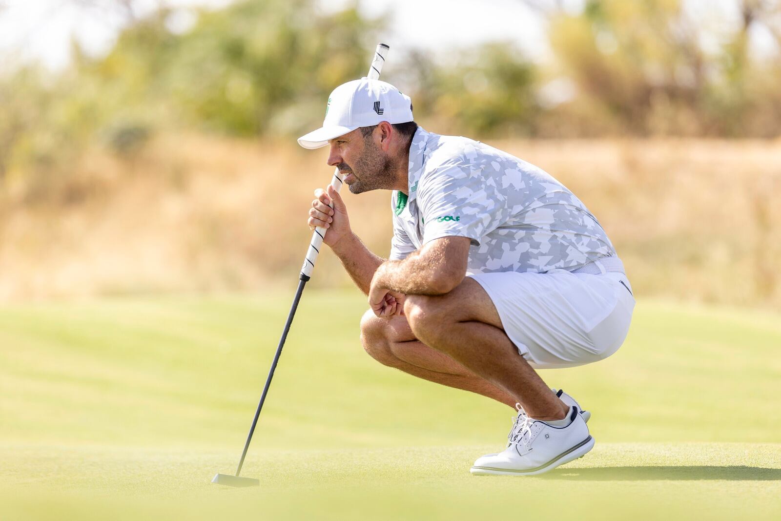 Charl Schwartzel, of Stinger GC, reads his putt on the 12th green during the semifinals of LIV Golf Team Championship Dallas at Maridoe Golf Club, Saturday, Sept. 21, 2024, in Carrollton, Texas. (Chris Trotman/LIV Golf via AP)