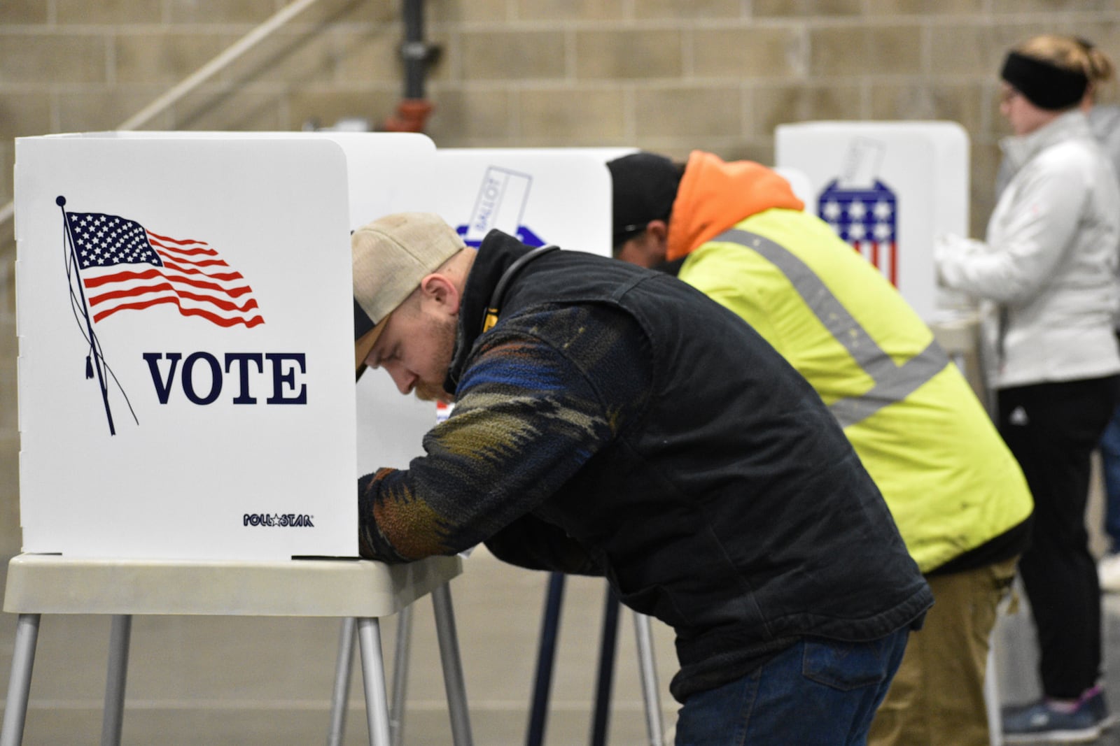 People fill out ballots during Election Day, at MetraPark, Tuesday, Nov. 5, 2024, in Billings, Mont. (AP Photo/Matthew Brown)