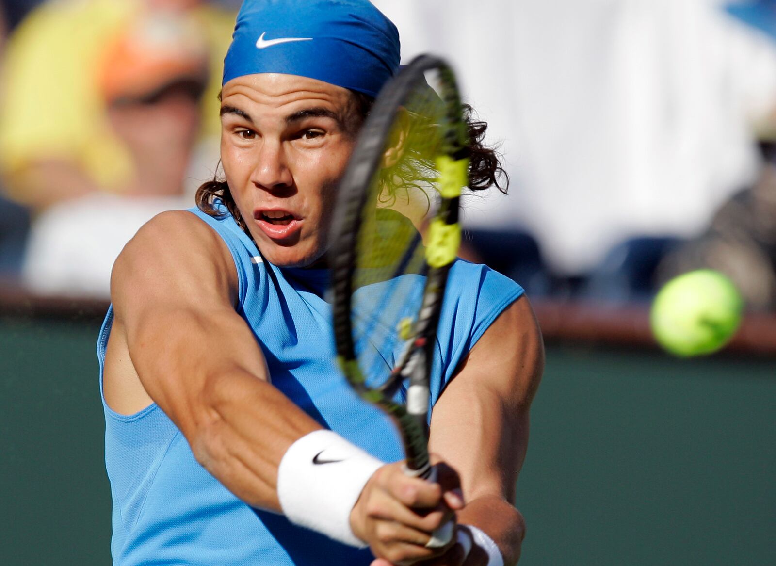 FILE - Rafael Nadal, of Spain, returns a shot to Amaud Clement, of France, during second round play the Pacific Life Open tennis tournament, Saturday, March 10, 2007, in Indian Wells, Calif., as he has announced he will retire from tennis at age 38 following the Davis Cup finals in November. (AP Photo/Mark J. Terrill, File)