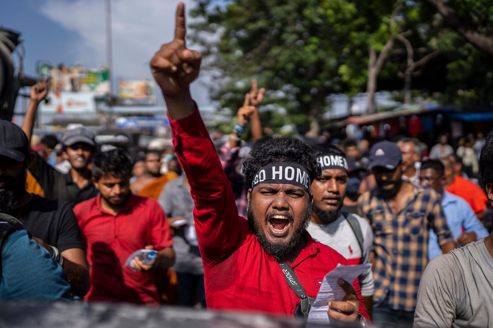 FILE - Protesters shouts slogans demanding acting president and prime minister Ranil Wickremesinghe resign in Colombo, Sri Lanka, in Colombo, Sri Lanka, on July 19, 2022. (AP Photo/Rafiq Maqbool, File)