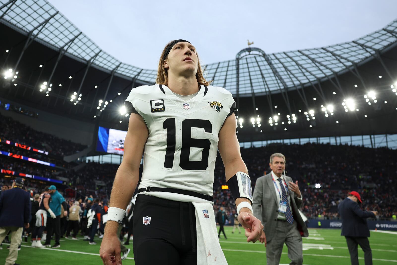 Jacksonville Jaguars quarterback Trevor Lawrence (16) leaves the field after an NFL football game at the Tottenham Hotspur stadium between the Jacksonville Jaguars and Chicago Bears in London, Sunday, Oct. 13, 2024. (AP Photo/Ian Walton)