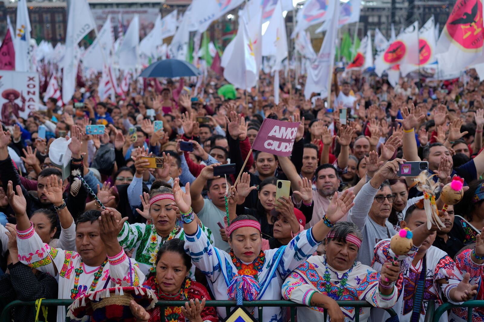 Supporters of President Claudia Sheinbaum attend a rally in the Zócalo, Mexico City's main square, on her inauguration day, Tuesday, Oct. 1, 2024. (AP Photo/Eduardo Verdugo)