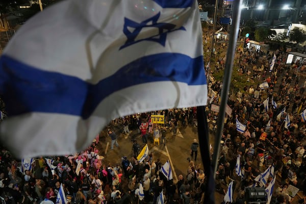 People take part in a protest demanding the end of the war and immediate release of hostages held by Hamas in the Gaza Strip, and against Prime Minister Benjamin Netanyahu's government in Tel Aviv, Israel, Saturday, May 3, 2025.(AP Photo/Ariel Schalit)