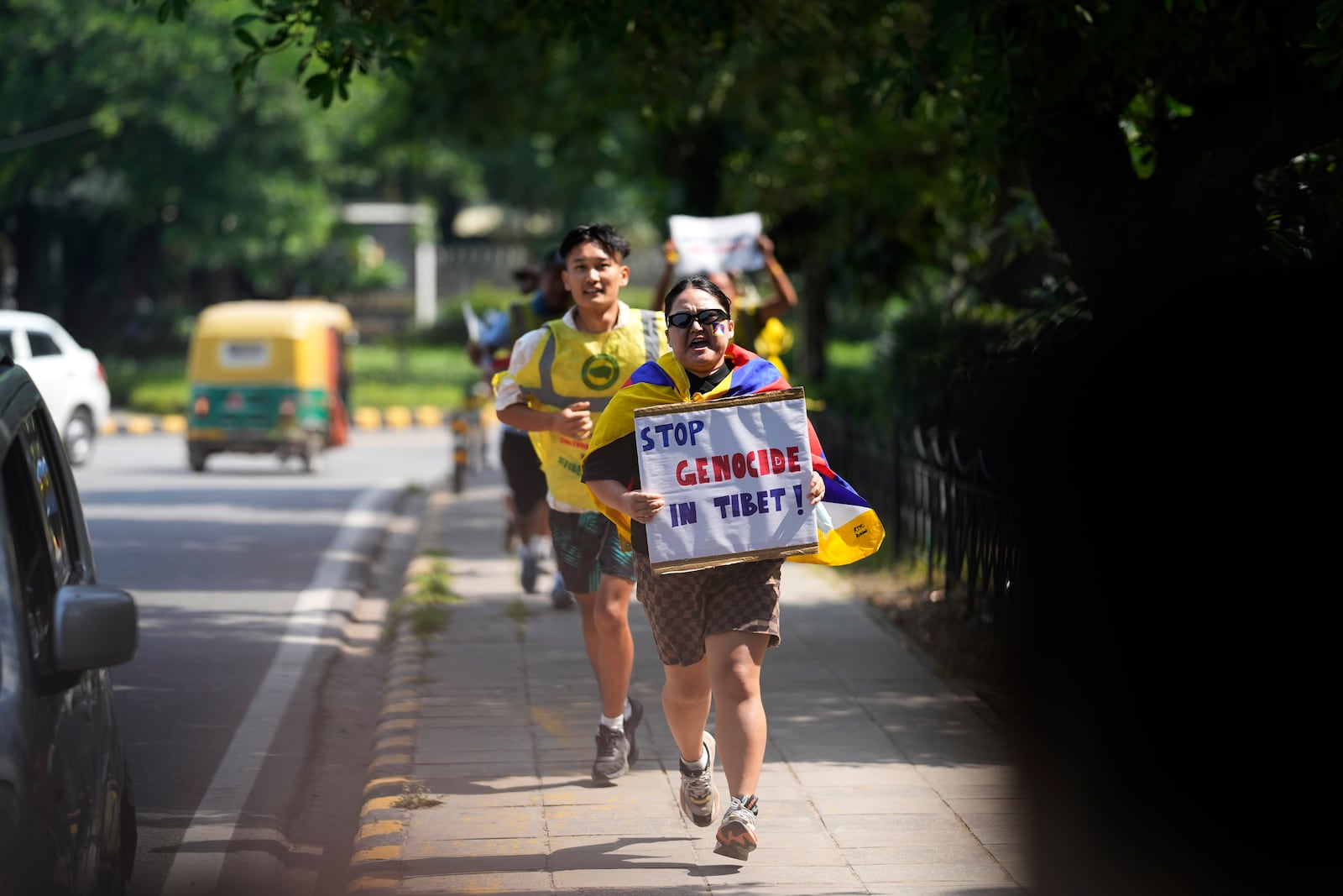 Exile Tibetans shout slogans against the human rights situation in Tibet during a protest to coincide China marking its 75th year of Communist Party rule, outside Chinese embassy, in New Delhi, India, Tuesday, Oct. 1, 2024. (AP Photo/Manish Swarup)