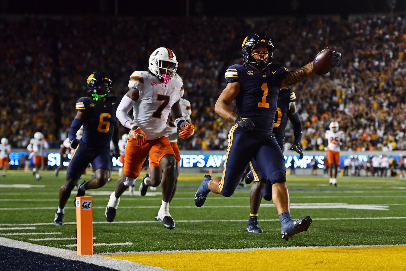 California Golden Bears running back Jaydn Ott (1) scores a 66-yard touchdown against the Miami Hurricanes during the second quarter of their game at Memorial Stadium in Berkeley, Calif., on Saturday, Oct. 5, 2024. (Jose Carlos Fajardo/Bay Area News Group via AP)