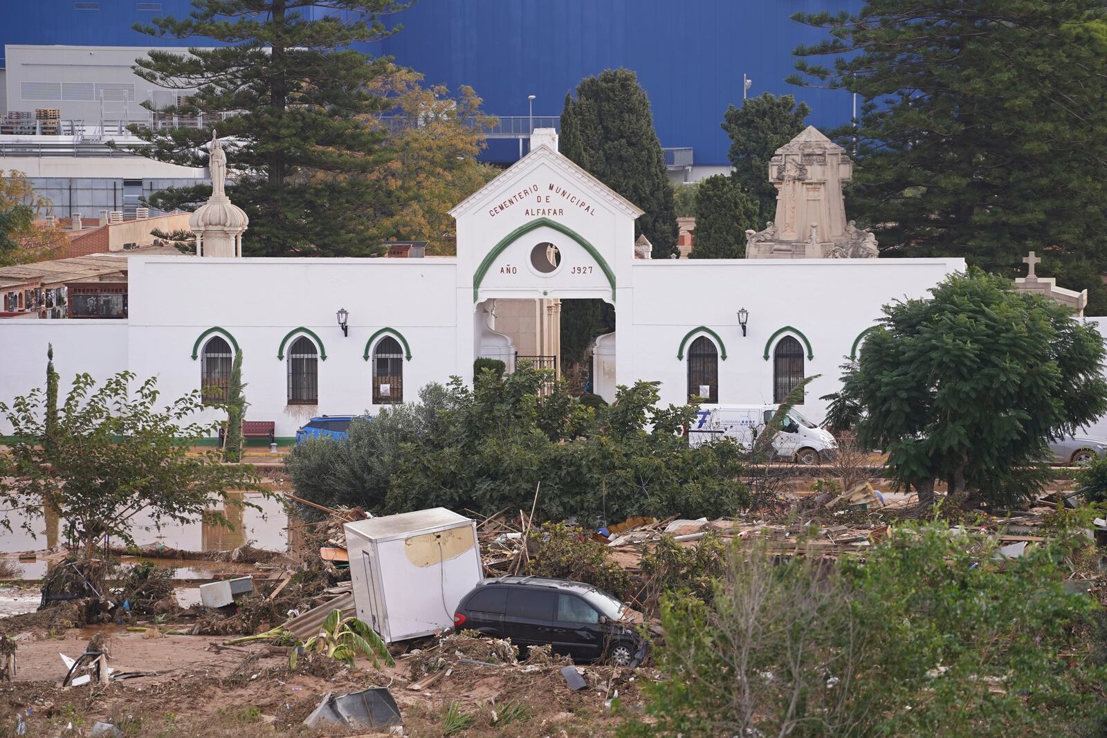 Damage is seen outside a cemetery on the outskirts of Valencia, Spain, Friday, Nov. 1, 2024 after flooding. (AP Photo/Alberto Saiz)