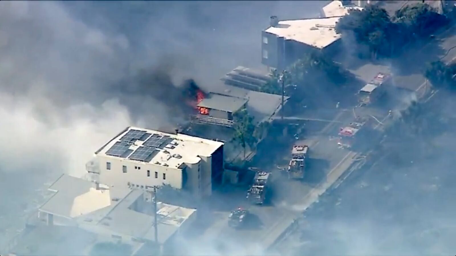 In this aerial still image provided by KABC-TV, shows Los Angeles County Fire Department crews scrambled to contain a small blaze fed by erratic wind gusts that pushed flames through dry brush near Broad Beach along Pacific Coast Highway in Malibu on Wednesday, Nov. 6, 2024. (KABC-TV via AP)