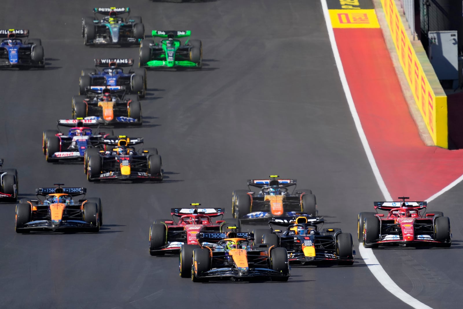 McLaren driver Lando Norris, of Britain, leads drives into Turn 1 during the U.S. Grand Prix auto race at Circuit of the Americas, Sunday, Oct. 20, 2024, in Austin, Texas. (AP Photo/Eric Gay)