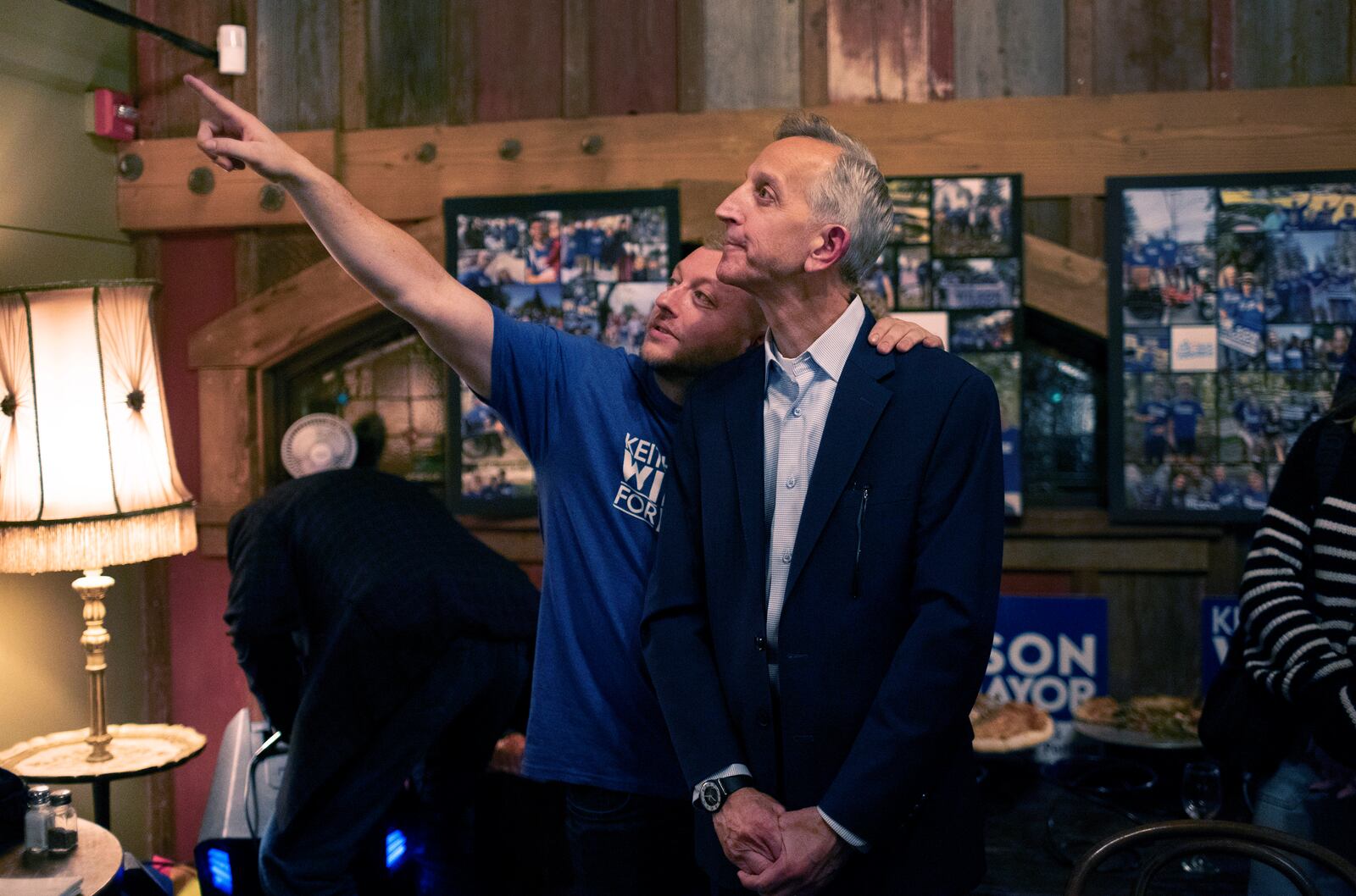 Portland mayoral candidate Keith Wilson looks at a large screen projecting a live television broadcast about the Portland mayoral race at Old Town Brewing in Northeast Portland, Tuesday, Nov. 5, 2024. (Beth Nakamura/The Oregonian via AP)