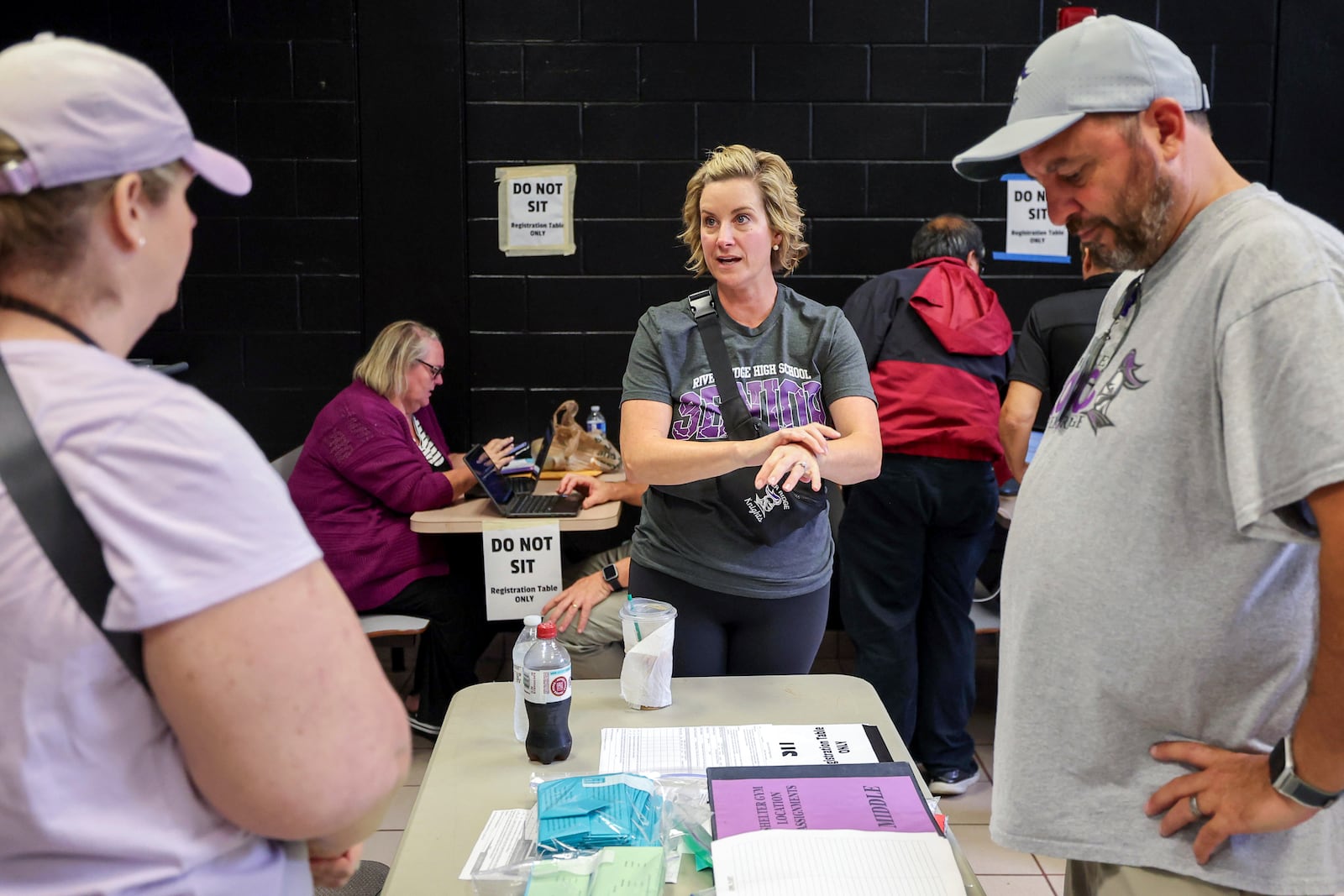 River Ridge High School principal Dr. Toni Zetzsche speaks with staff and volunteers as they ready the school for use as a shelter in preparation for Hurricane Milton on Monday, Oct. 7, 2024, in New Port Richey, Fla. (AP Photo/Mike Carlson)