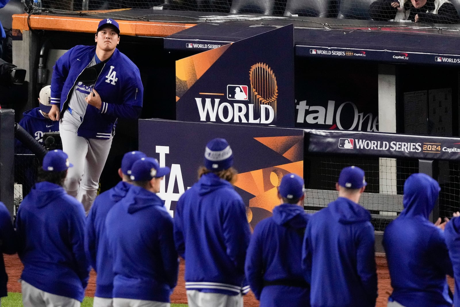 Los Angeles Dodgers' Shohei Ohtani run onto the field for introductions before Game 3 of the baseball World Series against the New York Yankees, Monday, Oct. 28, 2024, in New York. (AP Photo/Frank Franklin II)