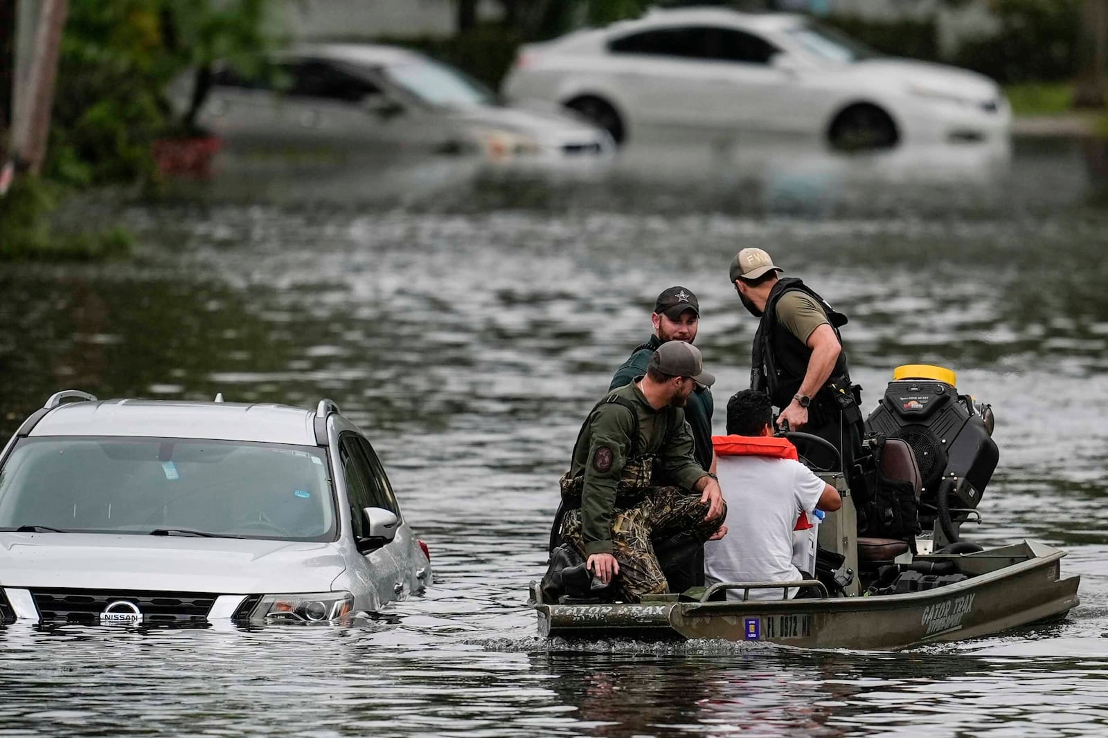 People are rescued from an apartment complex in the aftermath of Hurricane Milton, Thursday, Oct. 10, 2024, in Clearwater, Fla. (AP Photo/Mike Stewart)