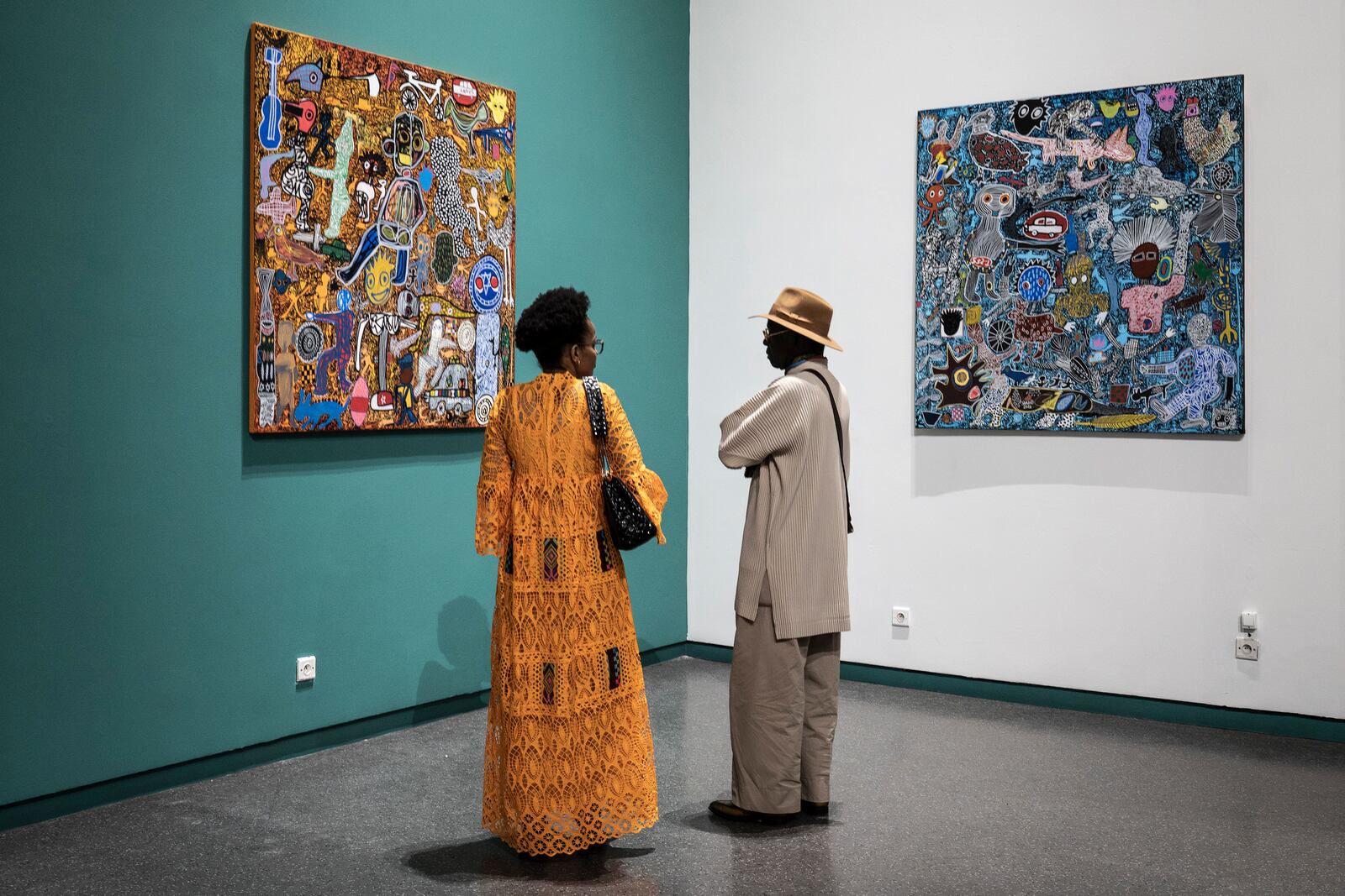 Visitors explore the international exhibit at the Dakar Biennale of Contemporary African Art in Dakar, Senegal, Friday, Nov. 8, 2024. (AP Photo/Annika Hammerschlag)