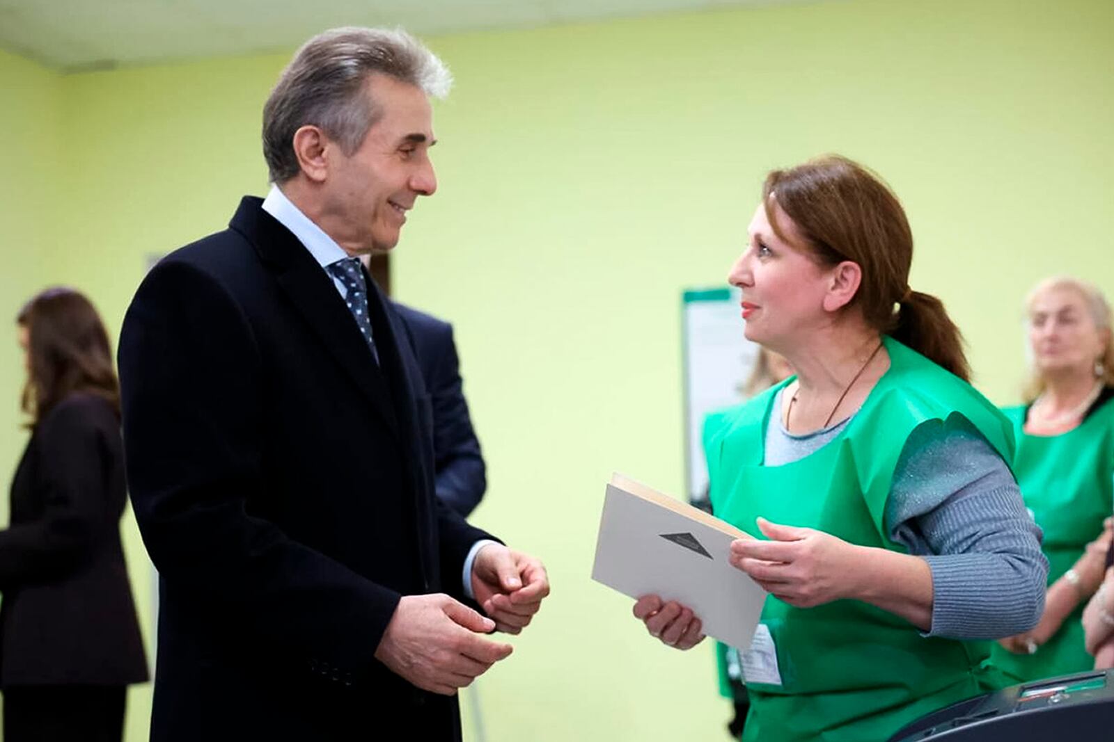 In this photo released by Georgian Dream party press service, Bidzina Ivanishvili, leader of the created by him the Georgian Dream party, arrives to vote at a polling station during the parliamentary election in Tbilisi, Georgia, Saturday, Oct. 26, 2024. (Georgian Dream party press service via AP)