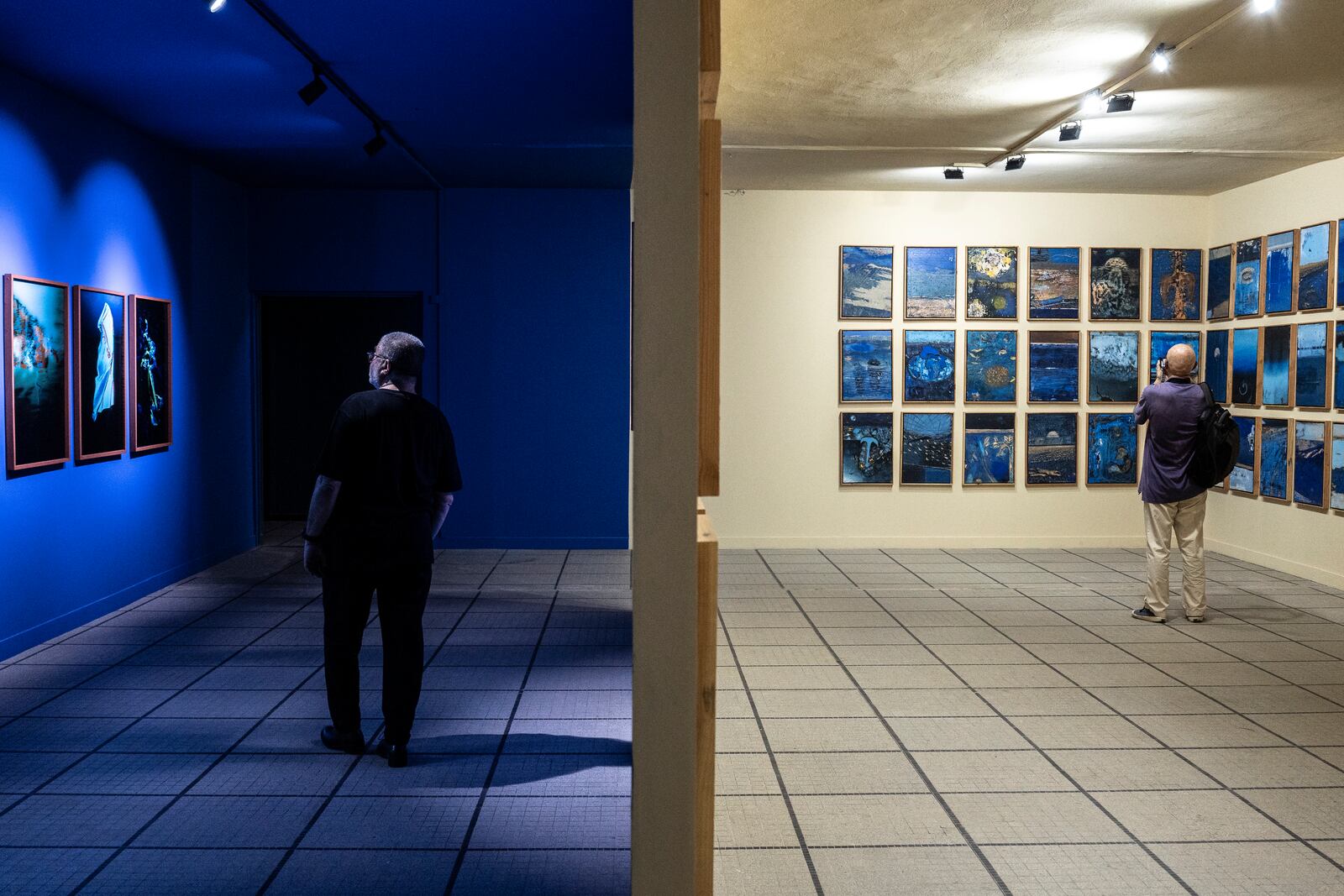 Visitors explore the international exhibit at the Dakar Biennale of Contemporary African Art in Dakar, Senegal, Friday, Nov. 8, 2024. (AP Photo/Annika Hammerschlag)