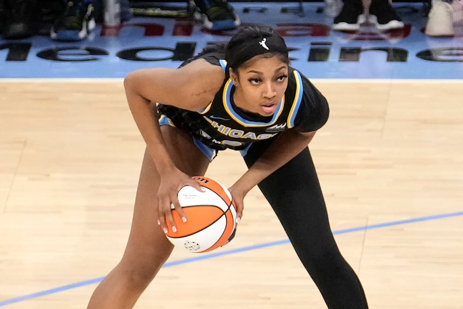 FILE - Chicago Sky's Angel Reese looks to pass during the team's WNBA basketball game against the Los Angeles Sparks on Thursday, May 30, 2024, in Chicago. (AP Photo/Charles Rex Arbogast, File)