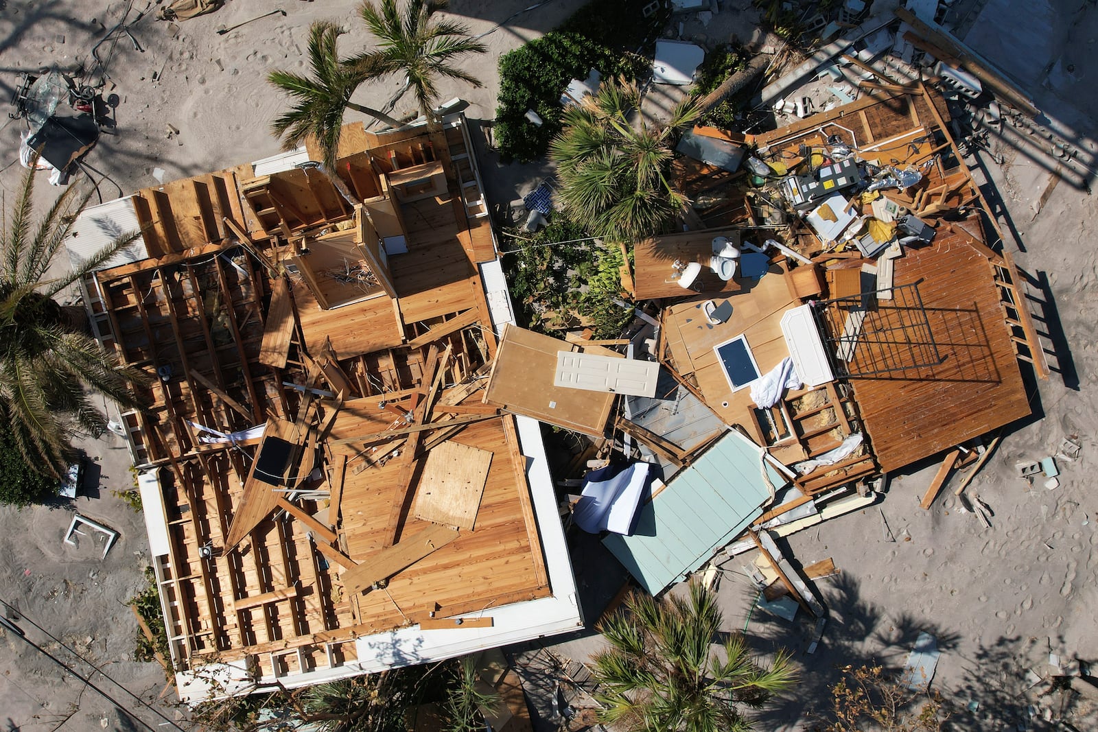 A house that was swept from its foundation lies broken open following the passage of Hurricane Milton, on Manasota Key, in Englewood, Fla., Sunday, Oct. 13, 2024. (AP Photo/Rebecca Blackwell)