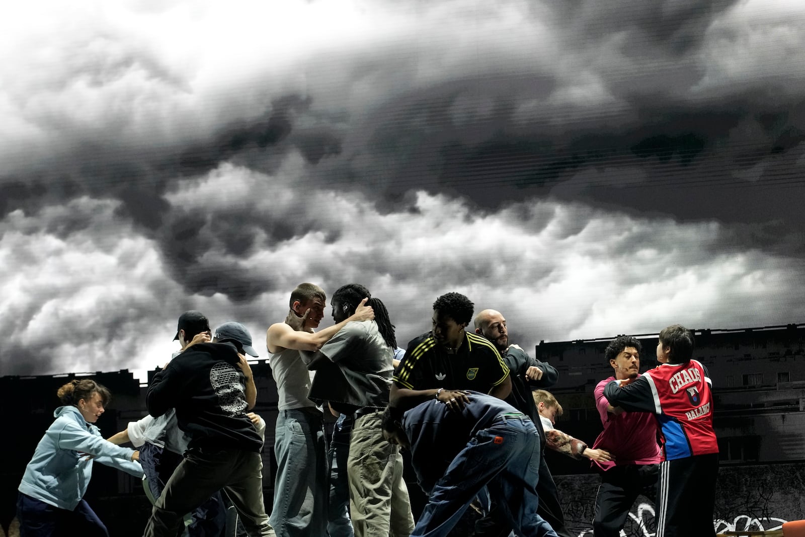 Actors perform during a rehearsal of La Haine musical show, in Tremblay en France, Tuesday, Sept. 17, 2024. (AP Photo/Christophe Ena)