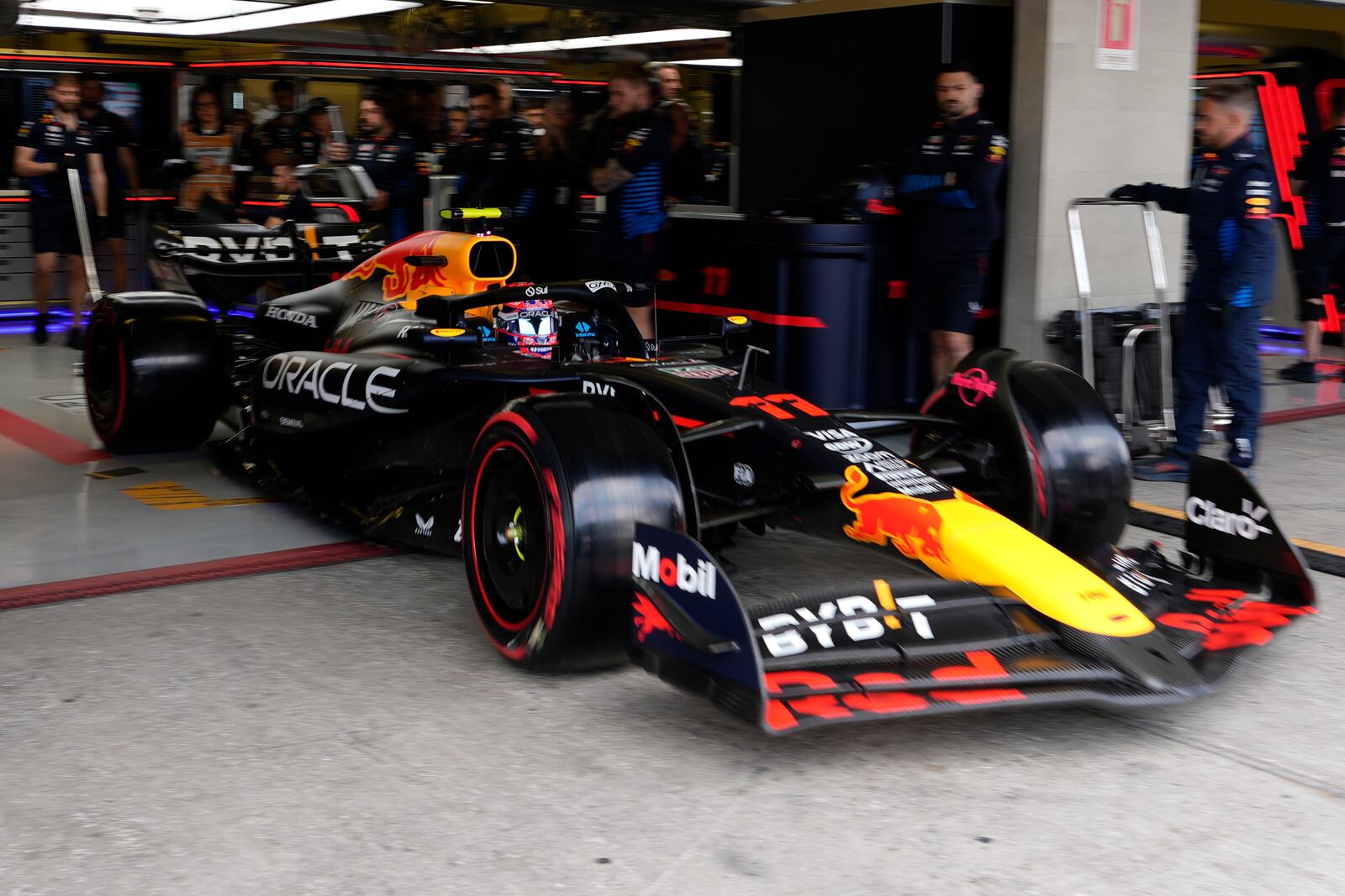 Red Bull driver Sergio Perez of Mexico leaves the pits during the third free practice ahead of the Formula One Mexico Grand Prix auto race at the Hermanos Rodriguez racetrack in Mexico City, Saturday, Oct. 26, 2024. (AP Photo/Moises Castillo)