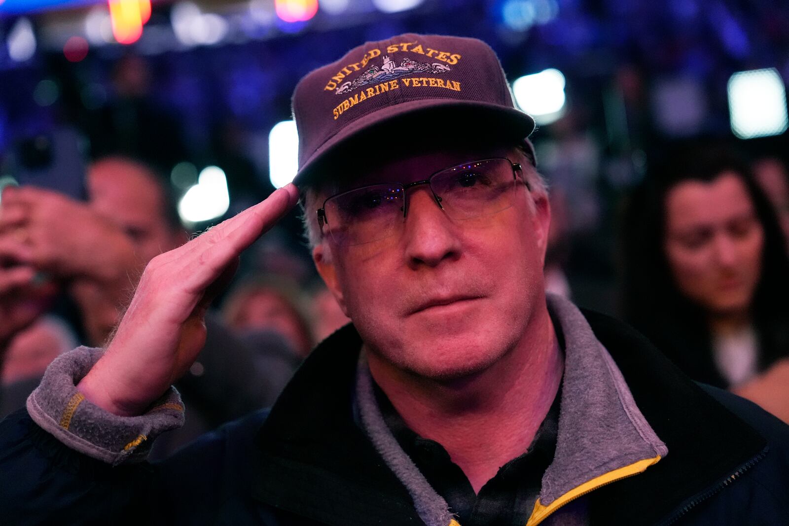 An attendee salutes at a campaign rally for Republican presidential nominee former President Donald Trump at Madison Square Garden, Sunday, Oct. 27, 2024, in New York. (AP Photo/Julia Demaree Nikhinson)