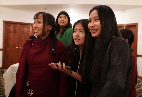 Friends, family, and community members attend the 18th birthday and enthronement ceremony of U.S.-born Buddhist lama, Jalue Dorje, at the Tibetan American Foundation of Minnesota in Isanti, Minn., on Saturday, Nov. 9, 2024. (AP Photo/Jessie Wardarski)