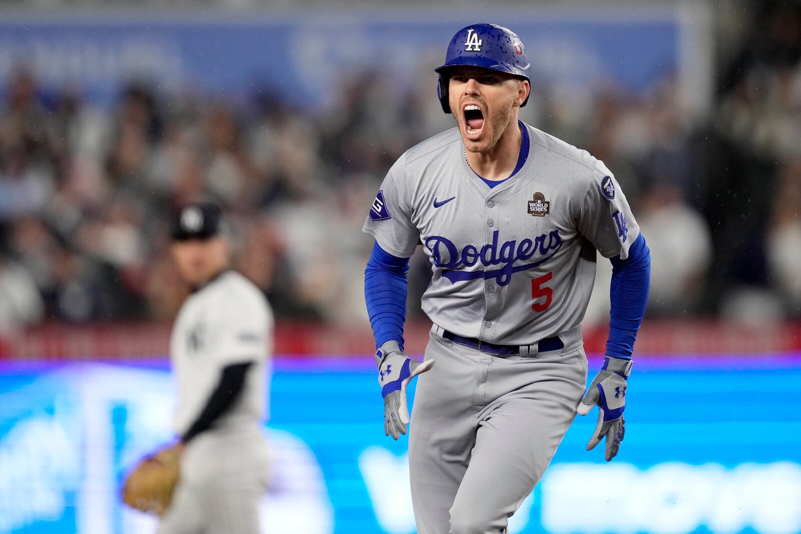 Los Angeles Dodgers' Freddie Freeman celebrates his two-run home run against the New York Yankees during the first inning in Game 4 of the baseball World Series, Tuesday, Oct. 29, 2024, in New York. (AP Photo/Ashley Landis)