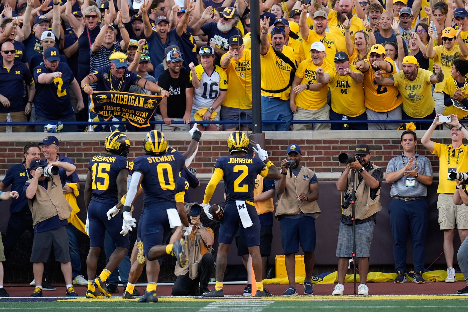 Michigan defensive back Will Johnson (2) celebrates his 42-yard interception for a touchdown against Southern California in the second half of an NCAA college football game in Ann Arbor, Mich., Saturday, Sept. 21, 2024. (AP Photo/Paul Sancya)