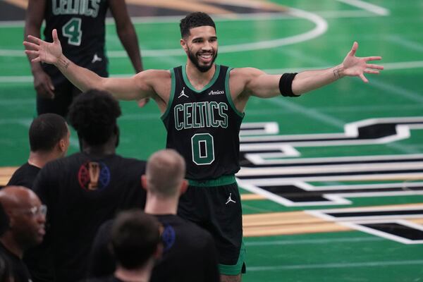 Boston Celtics forward Jayson Tatum (0) celebrates during the second half of an Emirates NBA Cup basketball game against the Cleveland Cavaliers, Tuesday, Nov. 19, 2024, in Boston. (AP Photo/Charles Krupa)