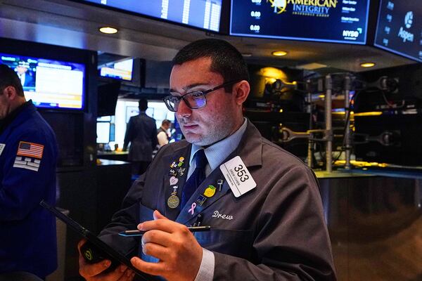 Trader Drew Cohen works on the floor of the New York Stock Exchange, Thursday, May 8, 2025. (AP Photo/Richard Drew)