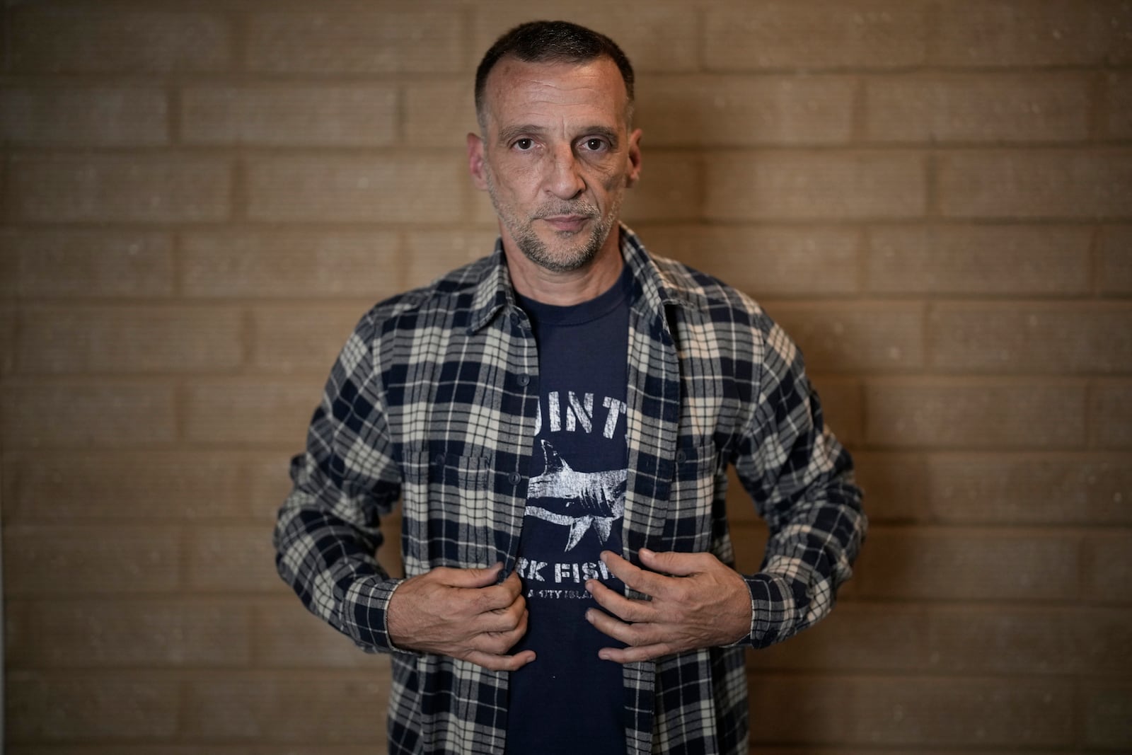 Mathieu Kassovitz poses after an interview with Associated Press, in Tremblay-en-France, Tuesday, Sept. 17, 2024. (AP Photo/Christophe Ena)