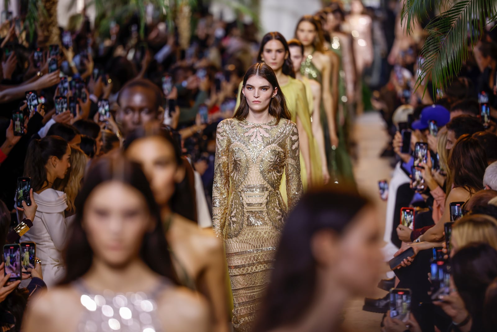 Models wear creations as part of the Elie Saab Spring/Summer 2025 collection presented Saturday, Sept. 28, 2024, in Paris. (Photo by Vianney Le Caer/Invision/AP)