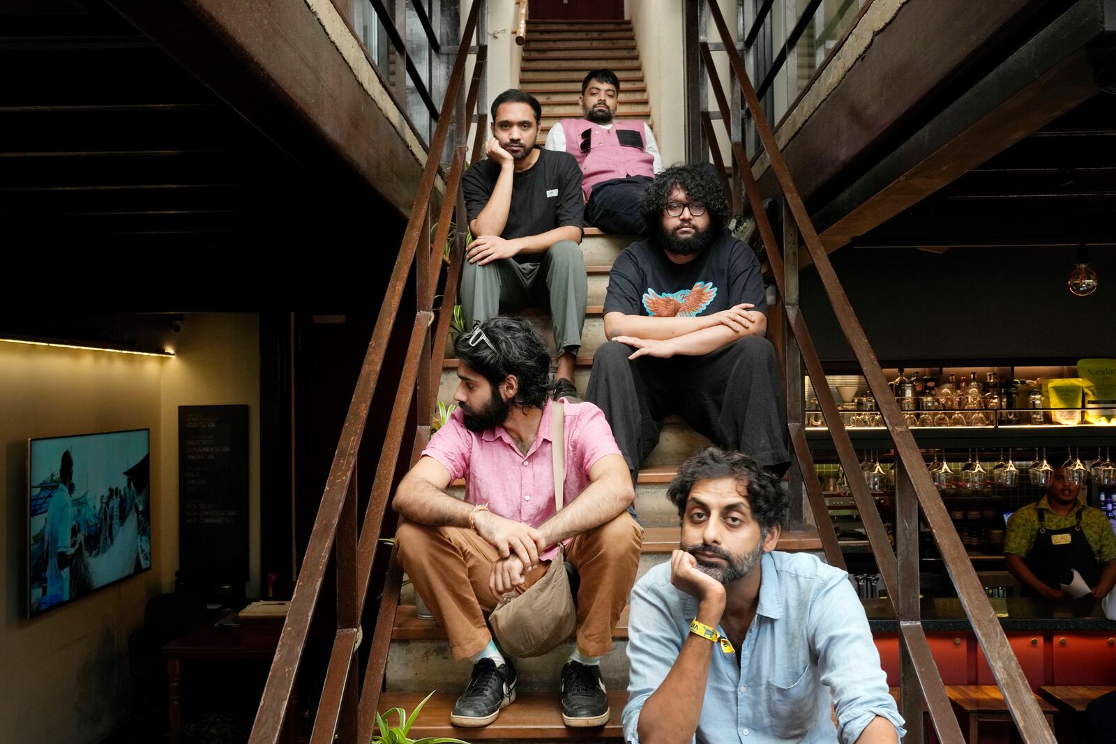 From bottom to top, Suryakant Sawhney, Rohit Gupta, Kartik Pillai, Dhruv Bhola and Karan Singh of Peter Cat Recording Co pose for a photograph in Mumbai, India, Friday, Aug. 2, 2024. (AP Photo/Rajanish Kakade)