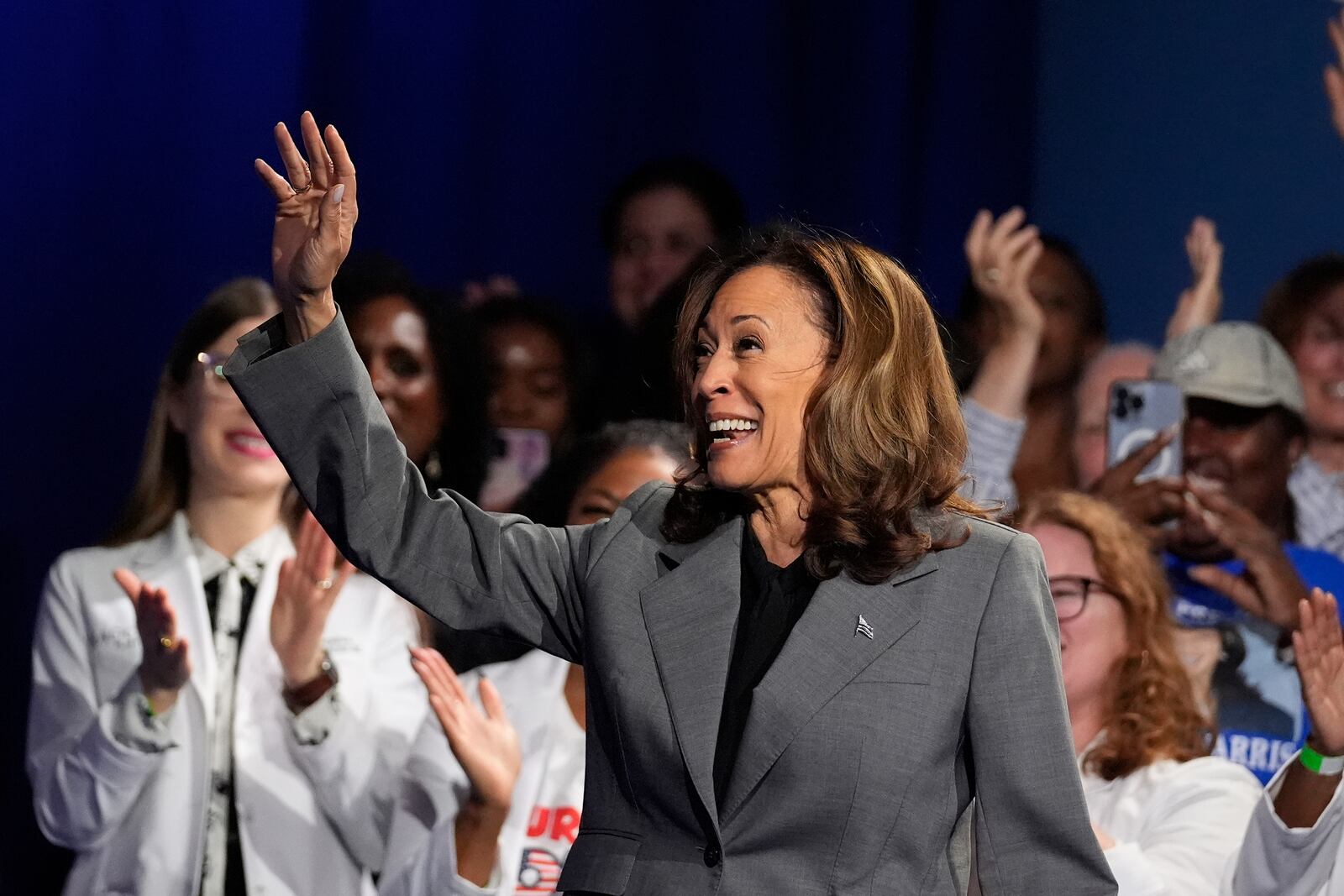 Vice President Kamala Harris waves to supporters at an Atlanta campaign event on Friday, Sept. 20, 2024. (AP Photo/Brynn Anderson)