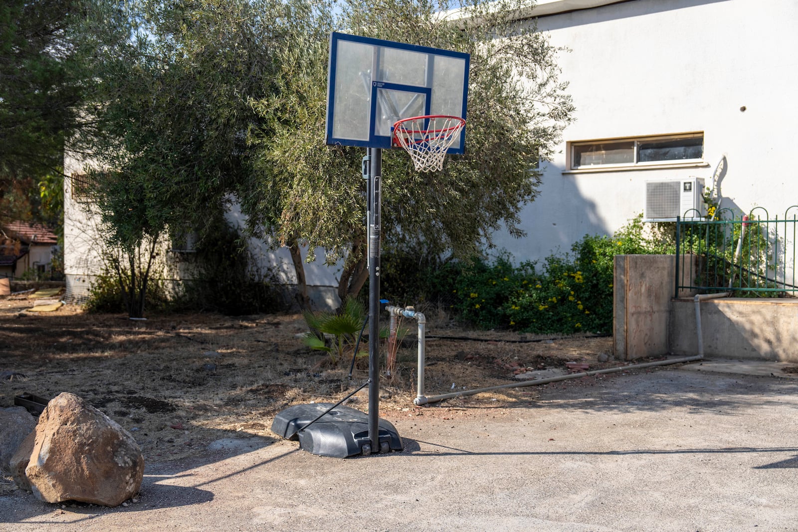 A basketball court stands empty in the tiny settlement of "Trump Heights" in the Israeli-controlled Golan Heights, where the Israeli residents are welcoming the election of their namesake. They hope Donald Trump's return to the U.S. presidency will breathe new life into the community. Thursday, Nov. 7, 2024. (AP Photo/Ariel Schalit)