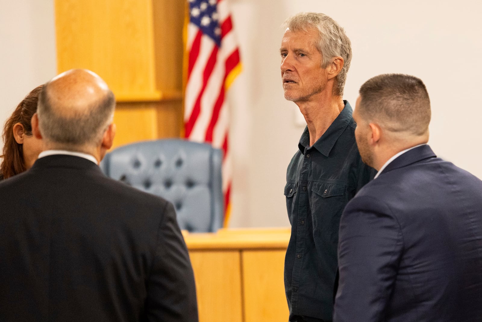 Tym Catterson, second from right, a contractor for OceanGate, talks to family members from the Titan tragedy after his testimony ended in a Coast Guard investigatory hearing on the causes of the implosion of an experimental submersible headed for the wreck of the Titanic, Monday, Sept. 16, 2024, in North Charleston, S.C. (AP Photo/Mic Smith)