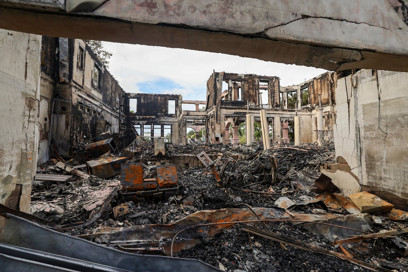 The remains of a home on Davis Island that burned during Hurricane Helene on Saturday, Sept. 28, 2024, in Tampa, Fla. (AP Photo/Mike Carlson)