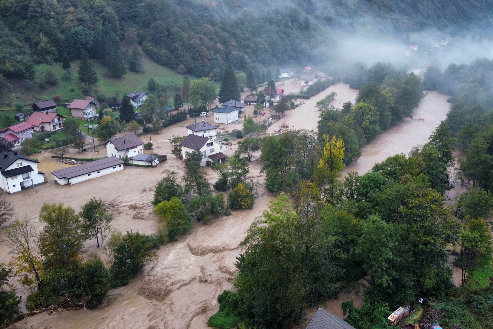 Flooded houses is seen after a heavy rain in the village of Luke, near Bosnian town of Fojnica , 50 kilometers (31 miles) west of Sarajevo, Bosnia, Friday, Oct. 4, 2024. (AP Photo/Robert Oroz)