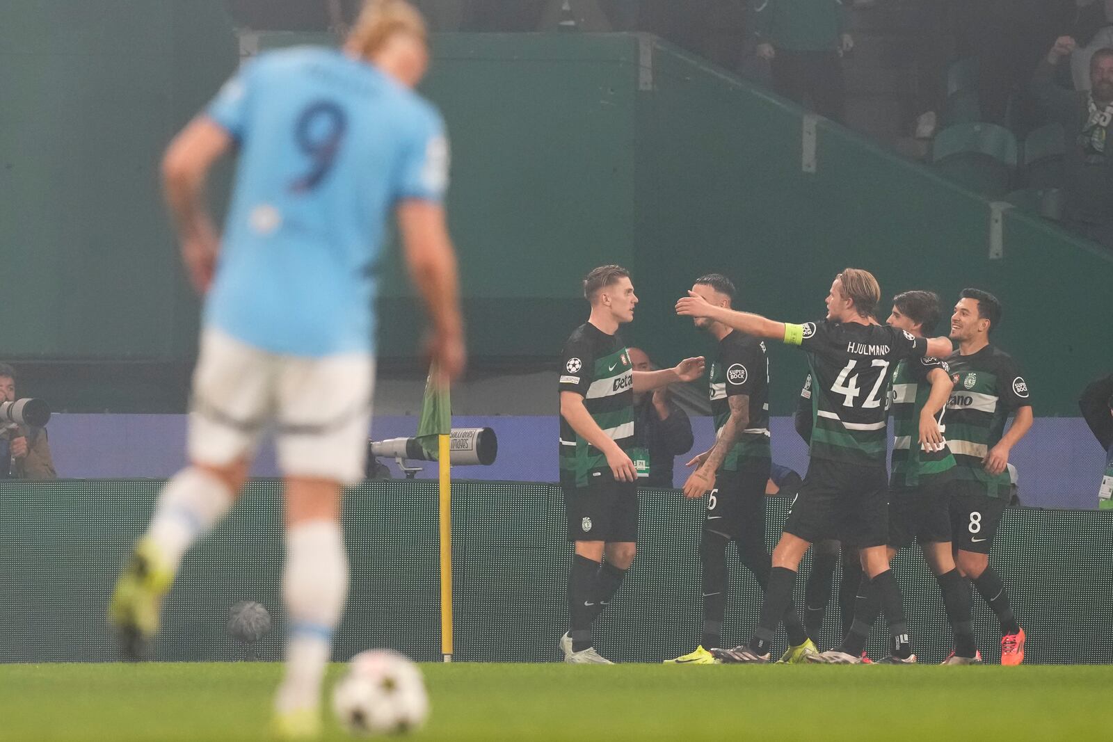 Sporting players celebrate after a goal during the UEFA Champions League opening phase match between Sporting and Manchester City in Lisbon, Portugal, Tuesday, Nov. 5, 2024. (AP Photo/Armando Franca)