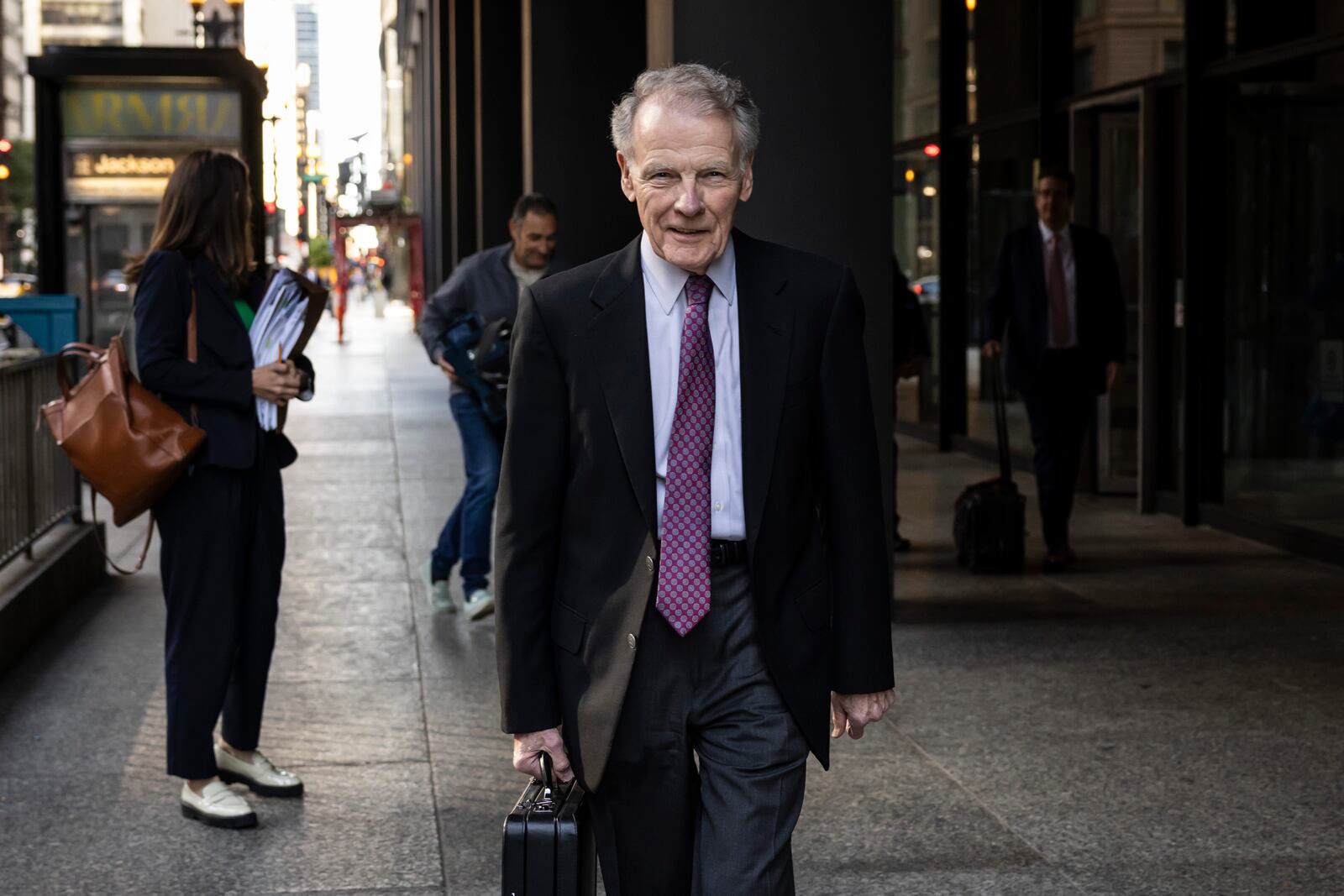 Illinois' former House Speaker Michael Madigan, charged in a multimillion-dollar racketeering and bribery scheme that included the state’s largest utility, ComEd, walks out of the Dirksen Federal Courthouse, Wednesday, Oct. 9, 2024 in Chicago. (Ashlee Rezin/Chicago Sun-Times via AP)