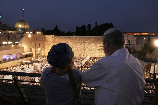 Israelis gather at the Western Wall, the holiest site where Jews can pray, to mark Jerusalem Day, an Israeli holiday celebrating the capture of east Jerusalem in the 1967 Mideast war, in Jerusalem's Old City, Monday, May 26, 2025. (AP Photo/Maya Alleruzzo)