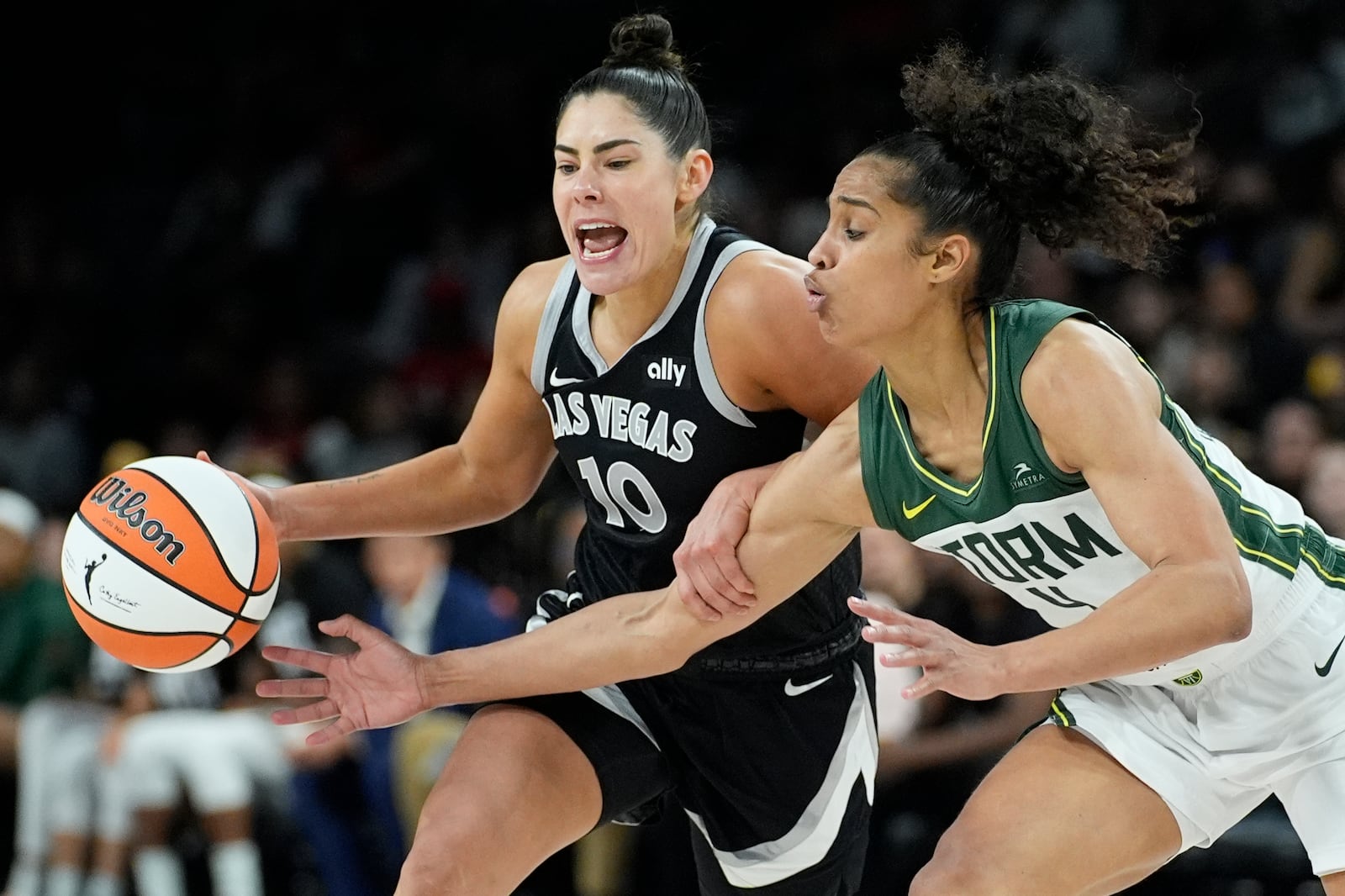 Las Vegas Aces guard Kelsey Plum (10) drives against Seattle Storm guard Skylar Diggins-Smith (4) during the second half in Game 2 of a WNBA basketball first-round playoff game Tuesday, Sept. 24, 2024, in Las Vegas. (AP Photo/John Locher)