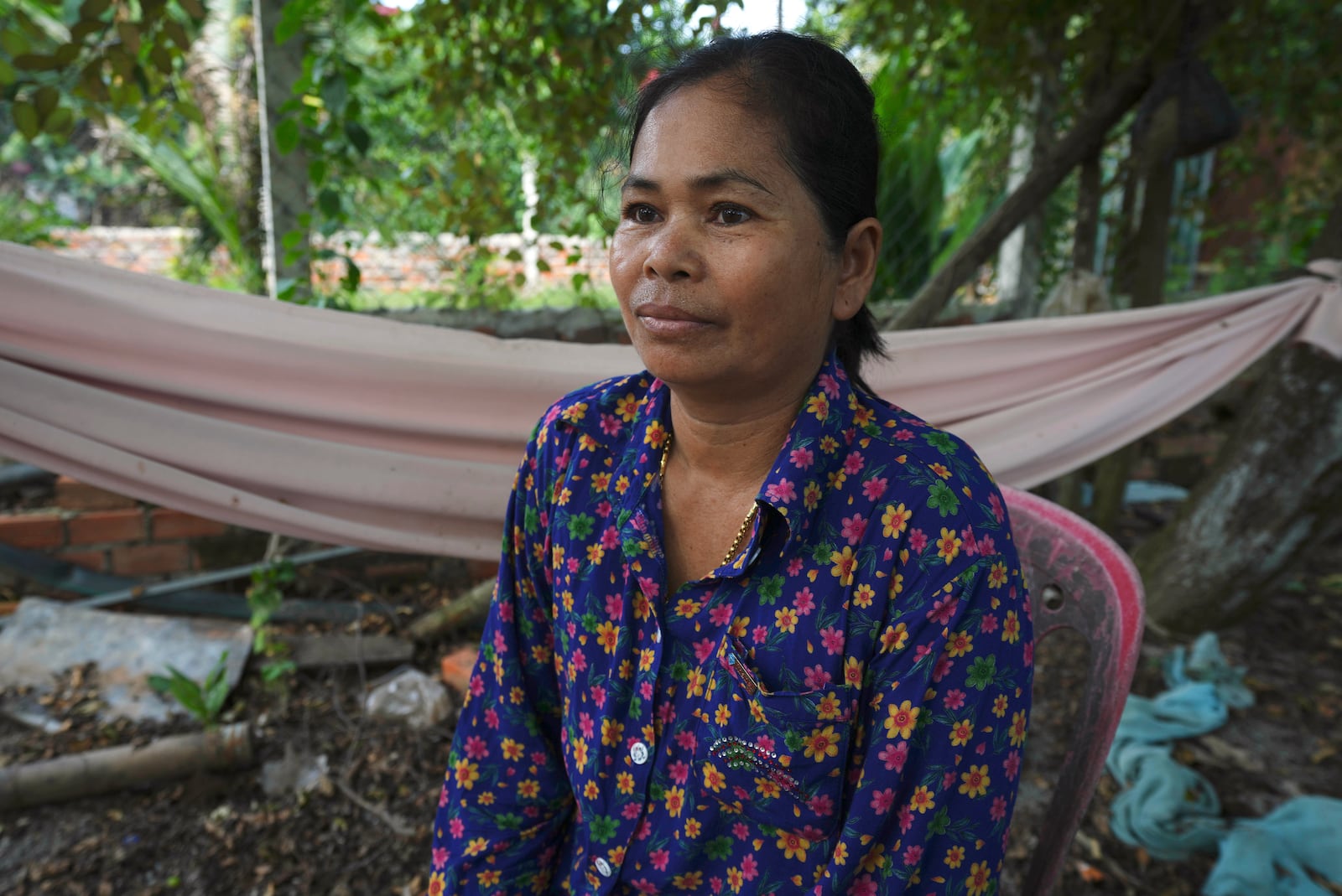 Norng La, a villager who lives along the Funan Techo Canal, is interviewed by The Associated Press at her home at Prek Takeo village eastern Phnom Penh Cambodia, Tuesday, July 30, 2024. (AP Photo/Heng Sinith)