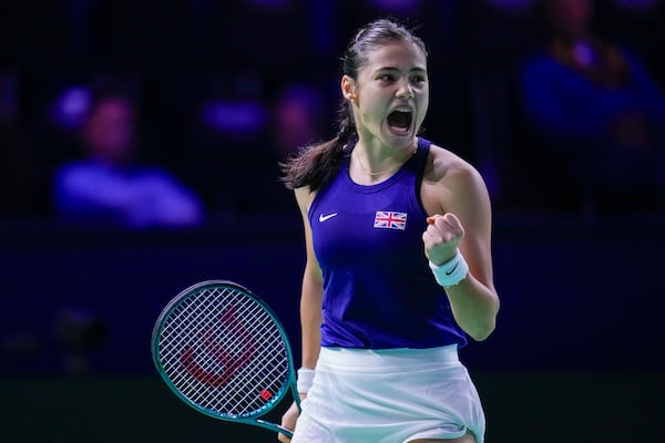 Emma Raducanu of Britain celebrates a point against Germany's Jule Niemeier during the Billie Jean King Cup Finals, at the Martin Carpena Sports Hall, in Malaga, southern Spain, on Friday, Nov. 15, 2024. (AP Photo/Manu Fernandez)