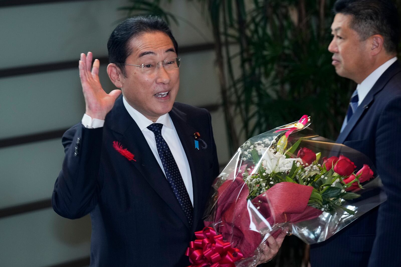 Japan's outgoing Prime Minister Fumio Kishida stops as media members asked him to make a comment before he leaves the prime minister's office in Tokyo Tuesday, Oct. 1, 2024. (AP Photo/Hiro Komae)