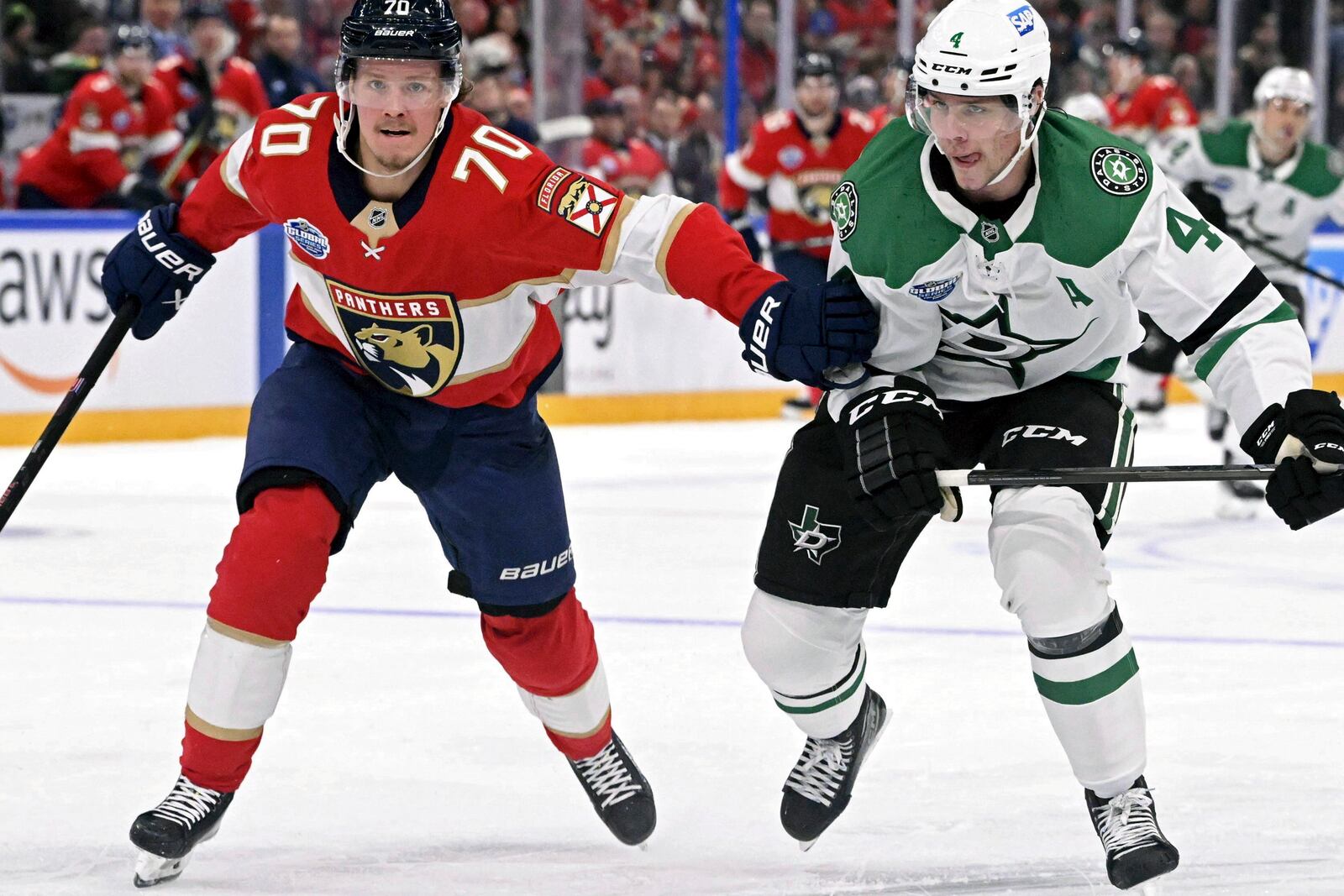 Florida Panthers' Jesper Boqvist, left, and Dallas Stars/ Miro Heiskanen skate during an NHL hockey game, Saturday, Nov. 2, 2024, in Tampere, Finland. (Heikki Saukkomaa/Lehtikuva via AP)