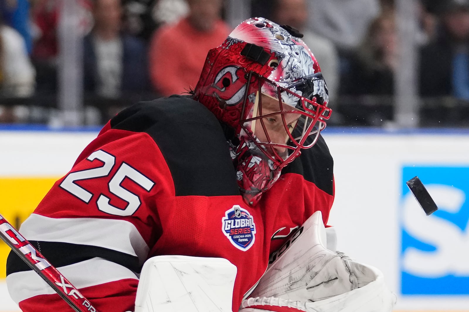 New Jersey goaltender Devils' Jacob Markstrom watches the puck during the NHL hockey game between Buffalo Sabres and New Jersey Devils, in Prague, Czech Republic, Friday, Oct. 4, 2024. (AP Photo/Petr David Josek)